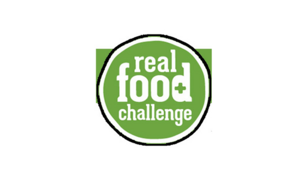 Real food challenge logo with white font in front of a green background